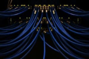 Close up shot of network cables running through a server racj=k.